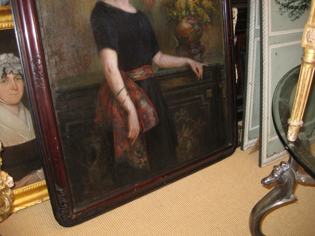 Large Painting of Woman  With Flowers In Front of a Cabinet