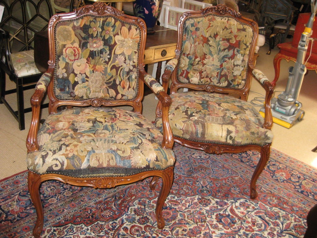Great looking pair of early 20th C French Style Arm chairs with antique tapestry upholstery