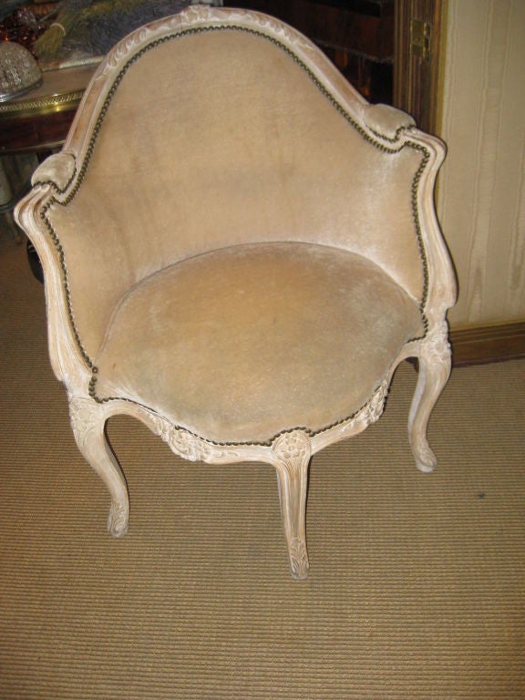 Charming french corner chair with three legs in the front and one in back.  This has a warn pickled or limed finish.