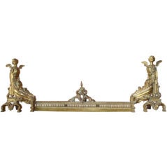 Figural Gilt Brass Chenets with Center Rail Fireplace Fender