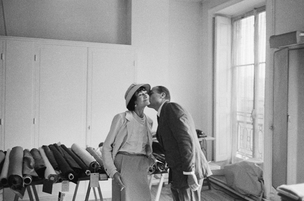 Coco Chanel receives a kiss from photographer Mark Shaw in this LIFE Magazine outtake taken at Atelier Chanel in 1957.
Chanel was quoted at the time as saying that 