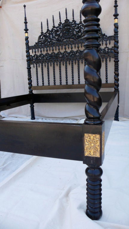 Hand carved Turkish Moghul style bed with ornate carved headboard and barley twist posts finished with spires.  18 karat gilt decoration to the posts and corners of the frame.  Fits a Queen size mattress, 60