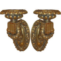 A pair of oversized giltwood sconces