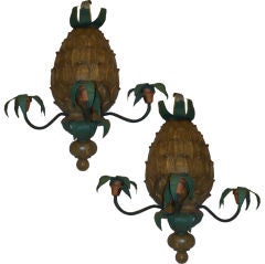 A pair whimsical painted pineapple sconces