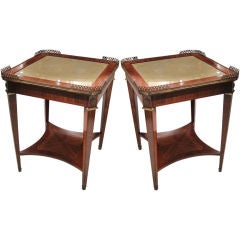 A pair of parquetry, leather-top tables w. brass gallery