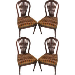 A set 4 balloon-back chairs attributed to Maison Jansen