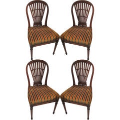 A set 4 balloon-back chairs attributed to Maison Jansen