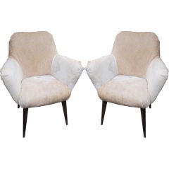 A pair of mid-century chairs upholstered in hide