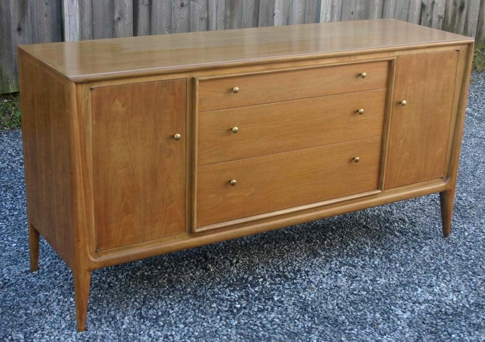 Walnut sideboard with cabinets and drawers; brass pulls. Matching display cabinet also available (dims 38