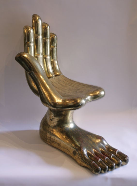 Gilt Hand Foot Chair Sculpture by Pedro Friedeberg. Classic hand chair by Friedeberg on an anatomical foot base. Gold leaf finish over red lacquer. Signed with burned in mark on underside, “Pedro Friedeberg”. With certificate of authenticity.