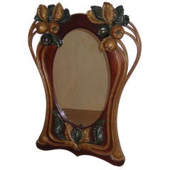 An Art Nouveau Parcel Gilt and Green Painted Mahogany Mirror