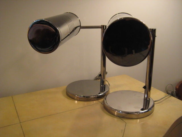 A pair of  desk lamps by Nessen, finished in nickel, pivoting arms.