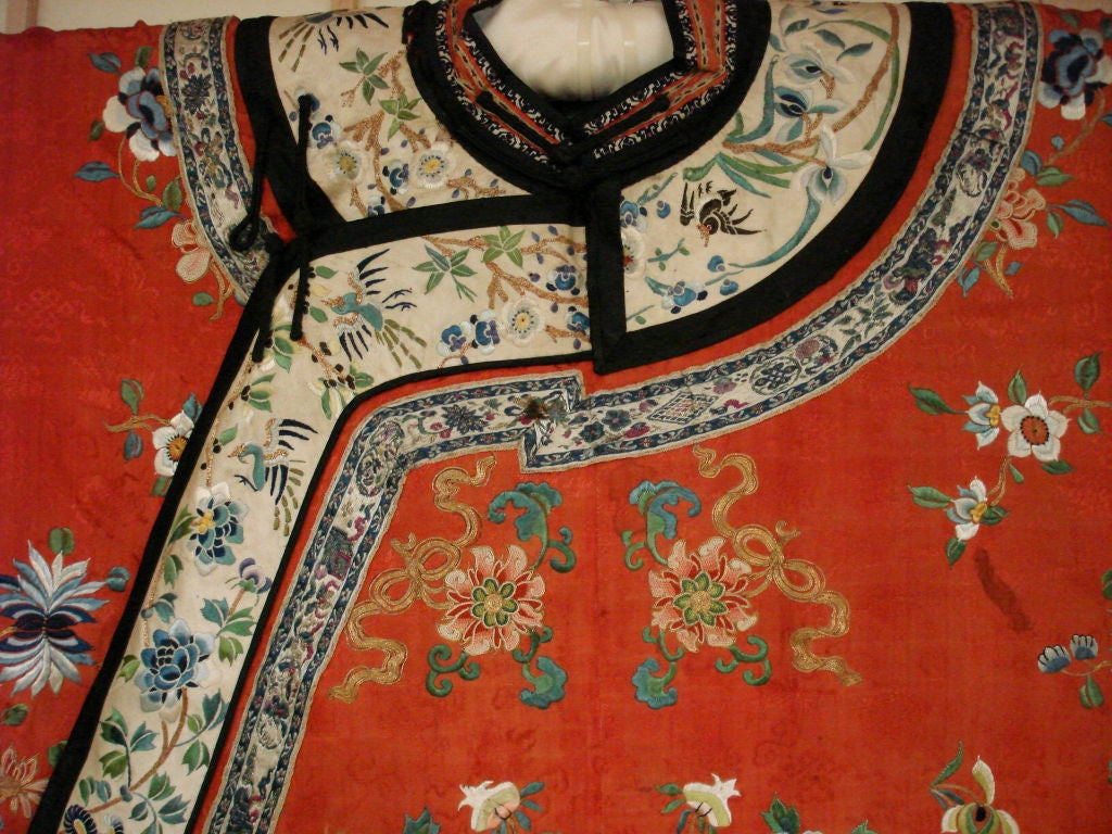 Fine Chinese Qing Dynasty noble woman formal robe in couching, satin and forbidden stitches. Very fine detail and quality and stunning color.