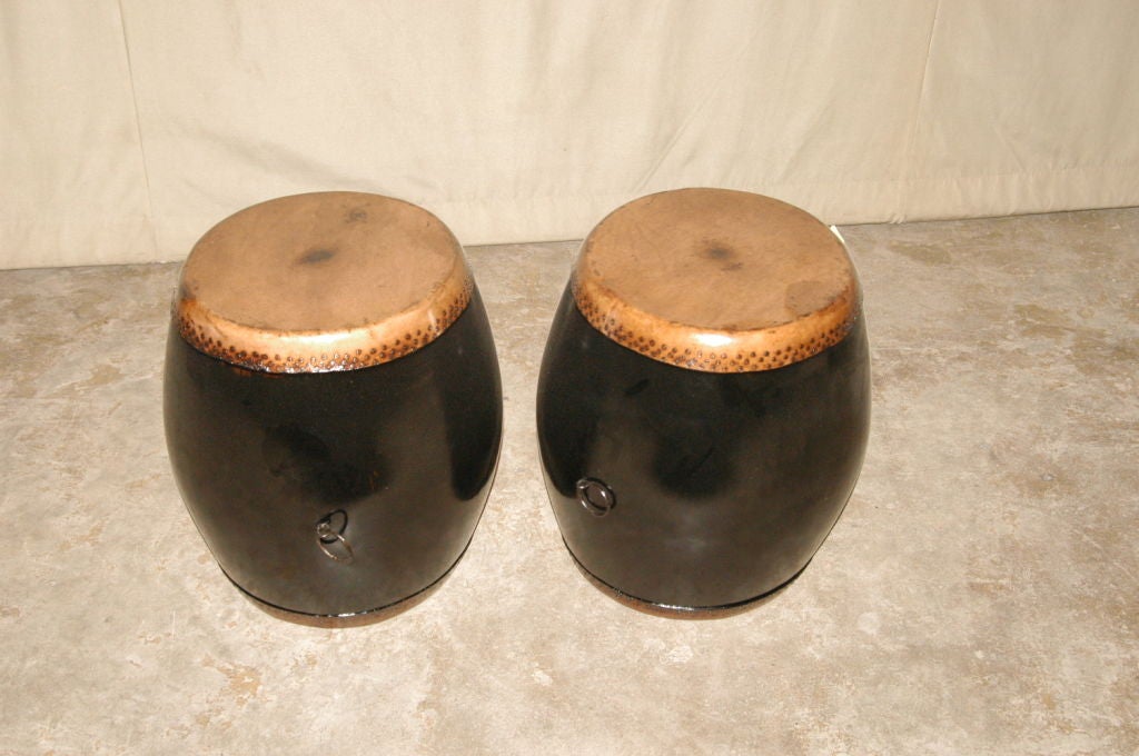 A Pair Of Black Lacquer Drums With Leather Top & Bottom