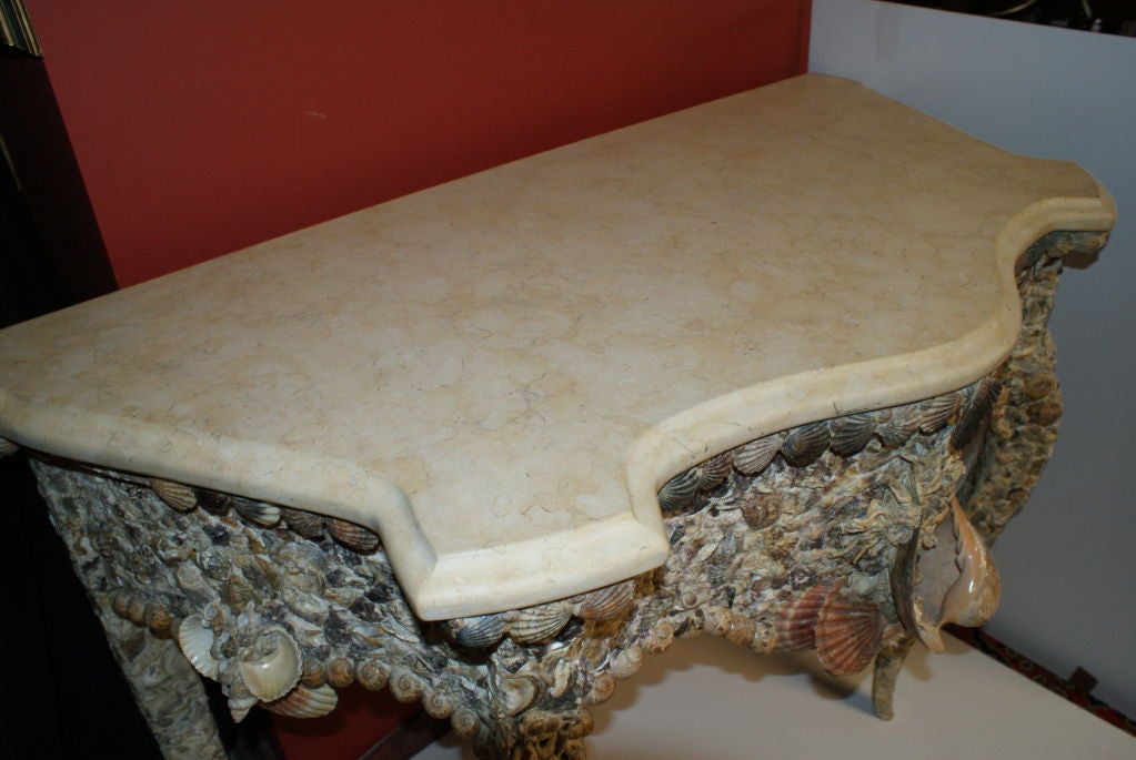 Magnificent mosaic shell inlayed console table,with beveled marble top,cabriole front legs,all natural shells.