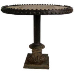 round table with riveted top and iron base round table with riveted top and iron base