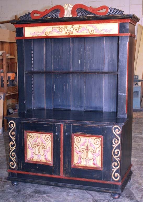 Folk art painted buffet in dark blue paint. Carved crown with 