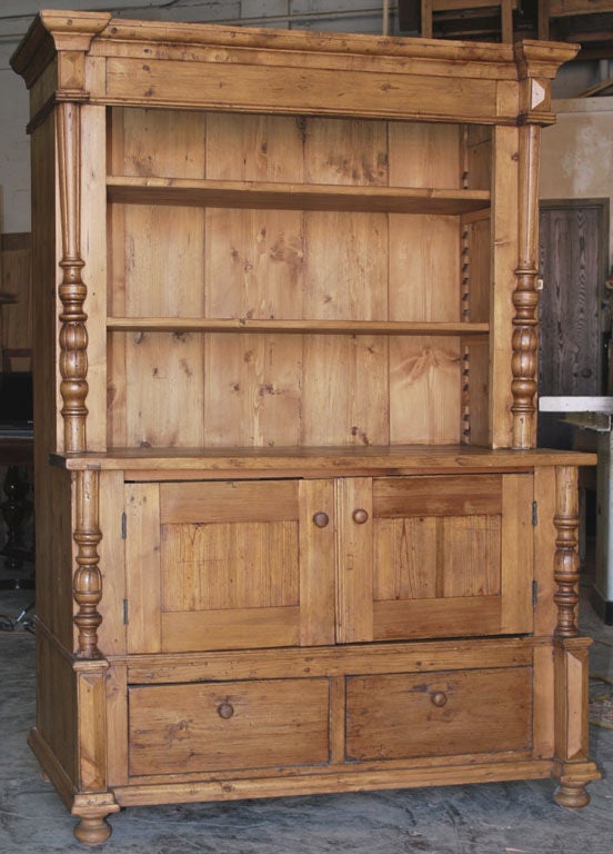 Charming country buffet or hutch with adjustable shelves. Has two drawers below, turned and carved columns.