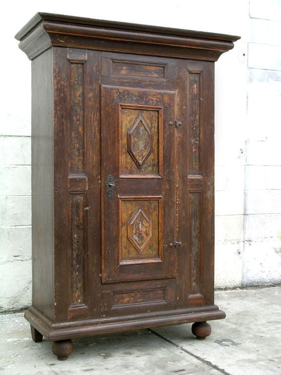 Well preserved cabinet with great age. We have painstakingly scraped off many layers of paint to reveal much of the original finish. You can still see the original inscription and floral decorations!
More detailed photos available upon request. 