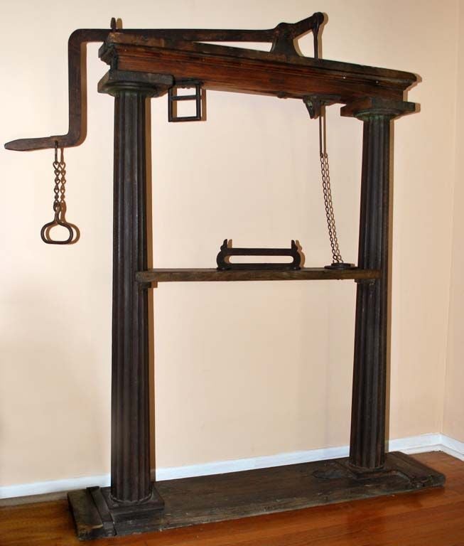 Great accent piece consisting of two massive cast iron columns.<br />
<br />
We found this scale on the Pampas of Argentina. It was once used to weigh cartloads of grain (cart and all) as well as other bulk merchandise. A rod would connect the
