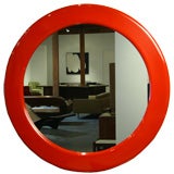 A large Milo Baughman round red lacquered mirror