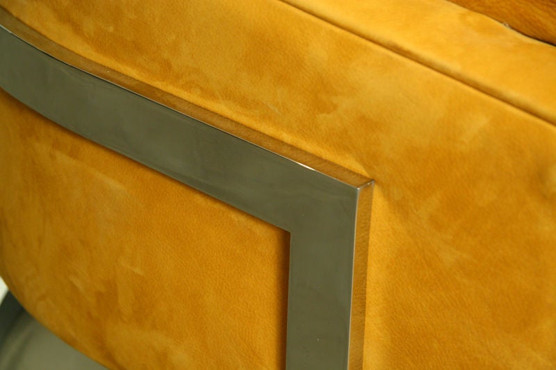 Single open grain leather and solid stainless lounge chair at 1stDibs