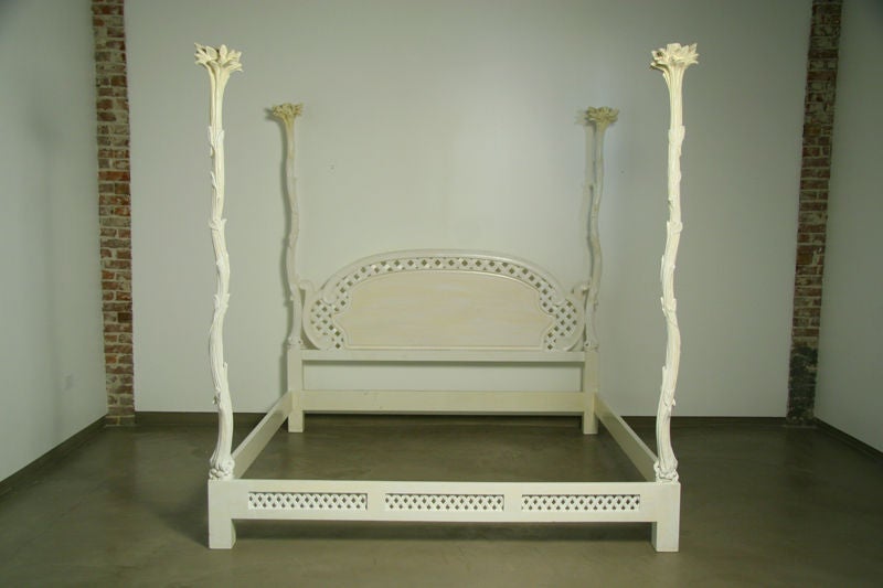 A stunning bed frame with four snaking vine-like posts culminating in a bursting leaf pattern at the top.   The finish shows some yellowing, though it is strange as the rest of the pieces from this set have a matte chalky finish.   Carving is very