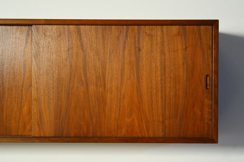 American Claro Walnut wall mounted cabinet with two sliding doors