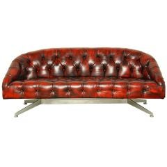 Red tufted leather and steel sofa by Ward Bennett