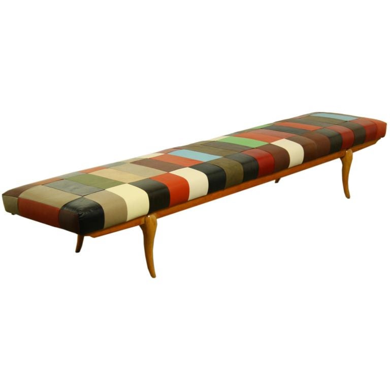 Long Brazilian leather bench with sculptural wooden base