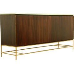 A mahogany and brass credenza by Paul McCobb for Calvin