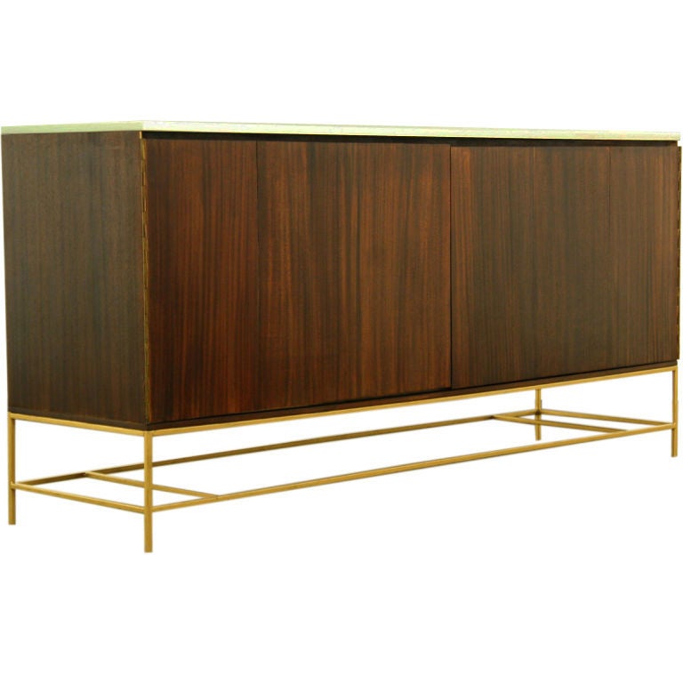 A mahogany and brass credenza by Paul McCobb for Calvin