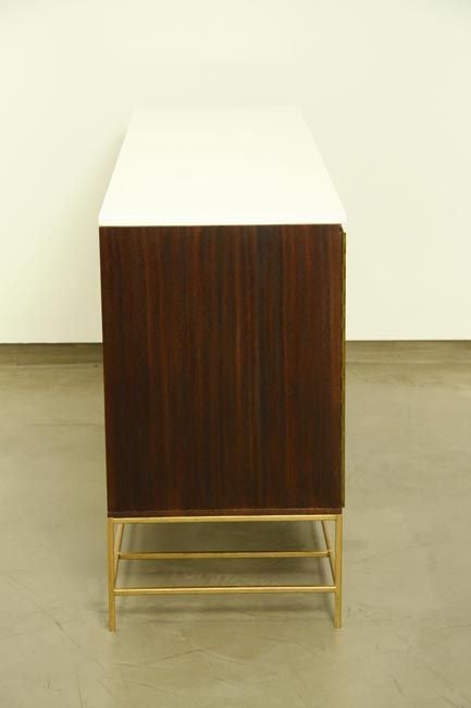 Mid-20th Century A mahogany and brass credenza by Paul McCobb for Calvin