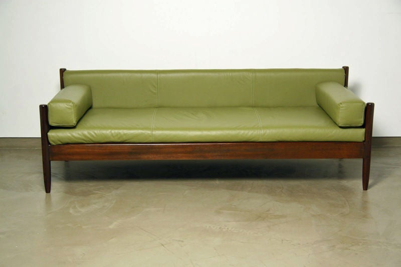 This daybed is very comfortable.  It's solid jacaranda construction is beautiful.  The cushion springs have all been replaced and the seat is firm and tight as if it were new.  This piece is finished on the back and could float in the middle of the