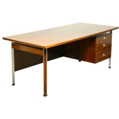 A rosewood and aluminum "Diplomat" desk by Finn Juhl