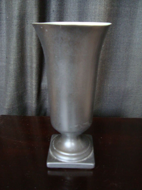 A nicely formed bell shaped vase in a Classic gray glaze with a fresh turquoise interior glaze.