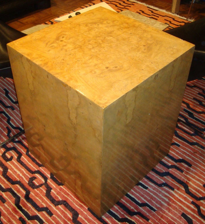 A cube table, pedestal or pedestal for a glass top in book matched burlwood veneer with a plaque on the inside engraved DUNBAR, BERNE, INDIANA
