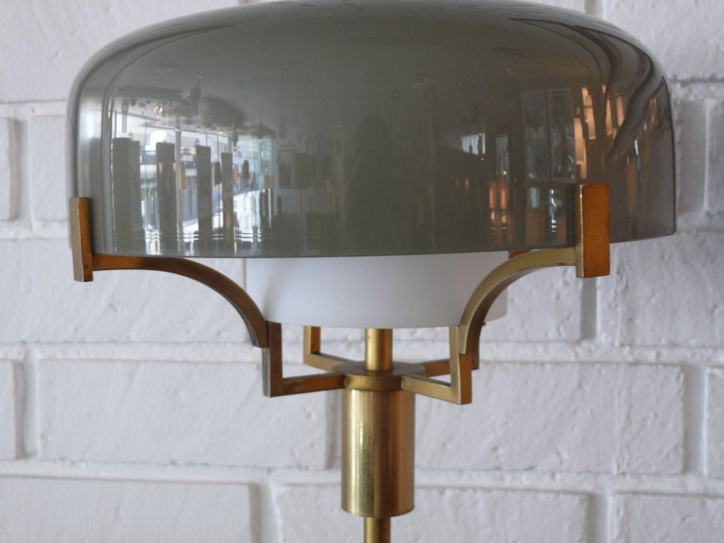 Gorgeous Italian floorlight by Stilnovo with glass shade and brass hardware with white marble base.  Excellent quality.