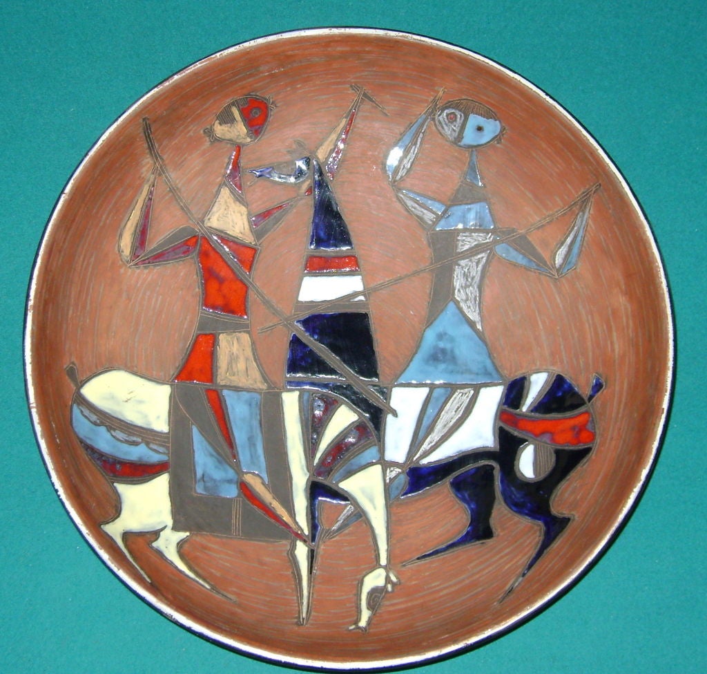 Depicting the chance encounter of two quasi-cubist knights, this large wall-plaque can also serve as a charger or centrepiece.