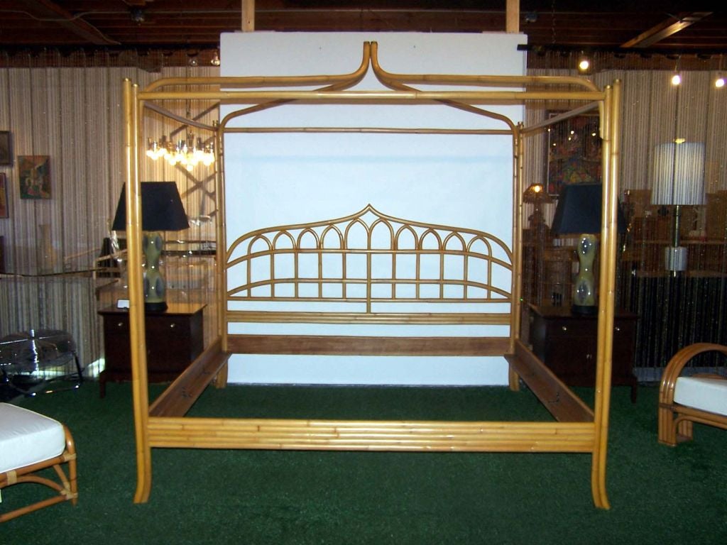 Vintage king rattan canopy bed with splayed legs, detailed headboard & brass accents.  ***Contact/Shipping Information: AOL (American Online) users may experience difficulties sending emails to us or receiving emails from us. If you have made an