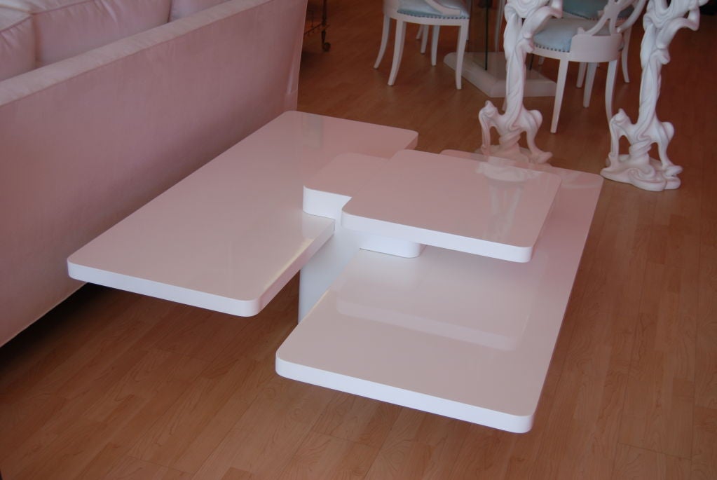 Incredible multi-level cubist coffee table expertly refinished in high gloss white lacquer.  Purchased from a prominent, published Miami Beach designer's estate.  Perfect for modern or mixed with traditional designer decor. Simply Chic!