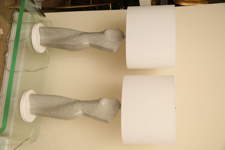 This unusual pair of Mid-Century Modern sensual grey pebble glazed ceramic torso lamps are very sculptural. They were studio made by Arpad and Ilonka Rosti in their NYC studio in the late 1940s. It was rare that they signed their work and their work