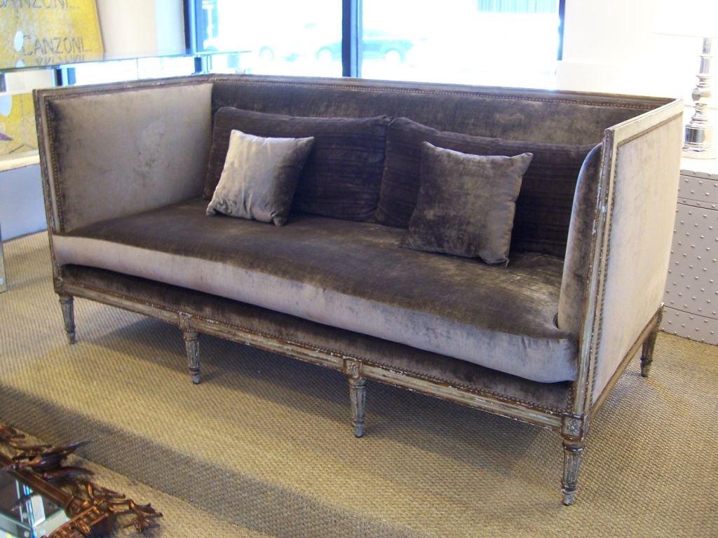 High glamour, boxed sofa in the Louis XVI style.  Incredible ornate painted wood trim.  Luxurious and comfortable!