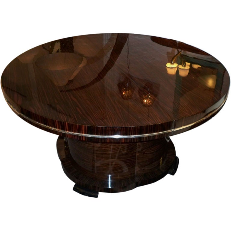 A Large Round Extending Art Deco Dining Table by J. DeCoene For Sale