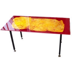 A Back Painted Glass Topped Cocktail Table by Bragalini