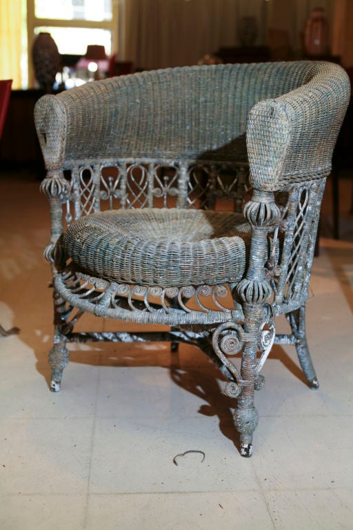 Wicker chair, late Victorian, intricate workmanship in old paint, mostly flaked off leaving faded tones of green, grey white