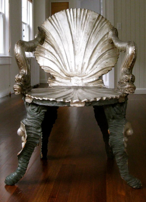 These rare early 19thC grotto arm chairs have a carved seashell back and seat. The arms are carved dolphins. Note the intricate leg details also.