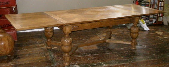 This Jacobean style table has the classic legs and design features of the mid 19thC.<br />
The table was originally a dark brown now sanded and bleached to a light modern patina. The table extends on each end to offer additional seating. The table