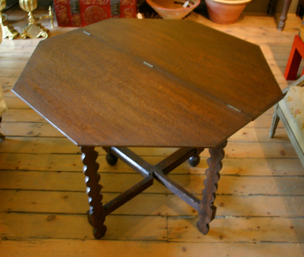 French oak octagonal gate leg table with folding top.  Could be used as a console<br />
when folded.  Small dining , center or end table.  Depth when folded 18.75