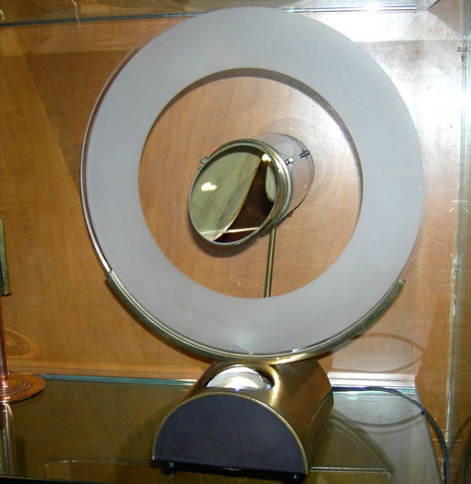 Not much information could be found on the designer, other than a patent entry for this very clock, dated 1981. Ours is hand numbered 231, of what I'm sure is a small edition. The design is quite ingenious, indeed. A single light beam is magnified